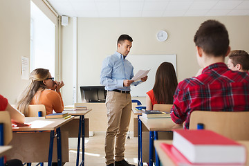 Image showing group of students and teacher with test results