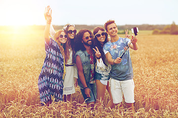 Image showing hippie friends with smartphone on selfie stick