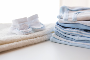 Image showing close up of baby boys clothes for newborn on table