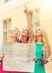 Image showing beautiful women with tourist map in the city