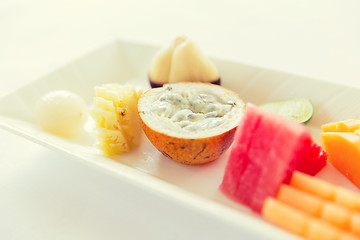 Image showing plate of fresh juicy fruit dessert at restaurant