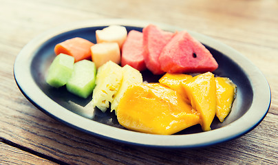 Image showing plate of fresh juicy fruits at asian restaurant