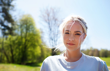 Image showing happy young volunteer woman outdoors