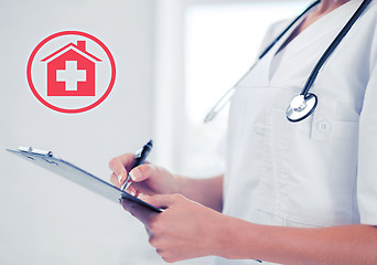 Image showing female doctor with stethoscope and prescription