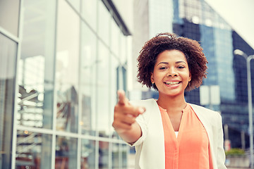Image showing happy young african american businesswoman in city