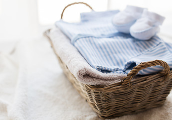 Image showing close up of baby clothes for newborn boy in basket