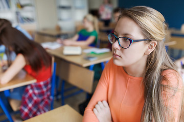 Image showing student girl in eyeglasses at school lesson