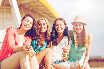 Image showing girls with drinks on the beach