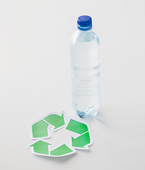 Image showing close up of plastic bottle and recycling symbol