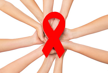 Image showing close up of hands with aids and hiv awareness ribbon