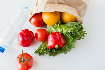 Image showing basket of fresh vegetables and water at kitchen