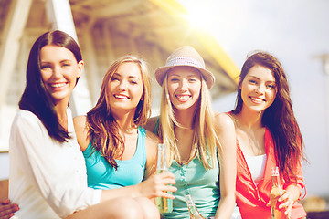 Image showing girls with drinks on the beach