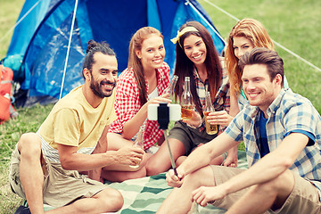 Image showing happy friends taking selfie by smartphone at camp