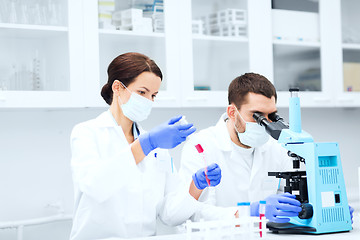 Image showing young scientists making test or research in lab