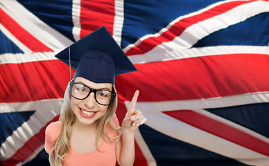 Image showing student woman in mortarboard over english flag