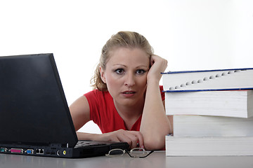 Image showing Overwhelmed girl doing homework