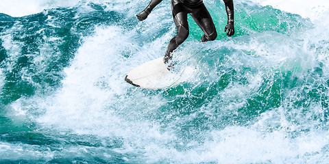 Image showing Surfer rides on turquoise ocean wave