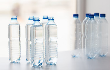 Image showing close up of bottles with drinking water on table