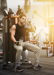 Image showing man exercising on gym machine