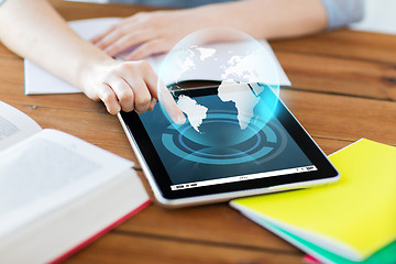 Image showing close up of student with tablet pc and notebook