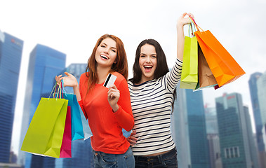 Image showing teenage girls with shopping bags and credit card