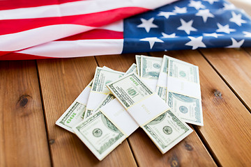 Image showing close up of american flag and dollar cash money