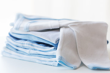 Image showing close up of baby boys clothes for newborn on table