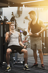 Image showing man exercising on gym machine