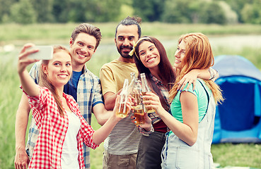 Image showing happy friends taking selfie by smartphone at camp