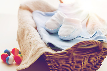 Image showing close up of baby clothes for newborn boy in basket