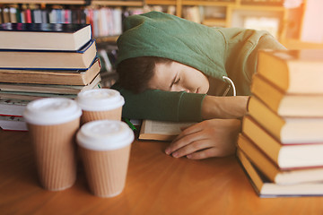 Image showing tired student or man with books in library