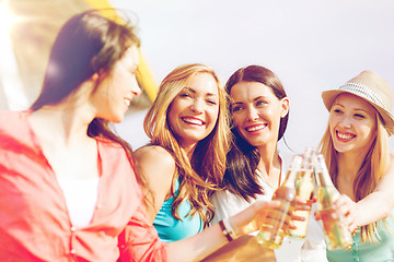 Image showing girls with drinks on the beach