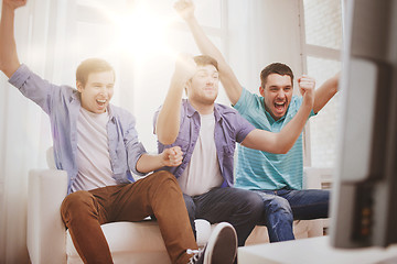 Image showing happy male friends at home