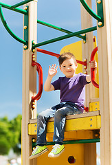 Image showing happy little boy climbing on children playground