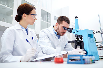 Image showing young scientists making test or research in lab