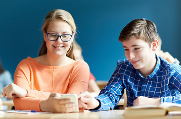 Image showing students with smartphone texting at school