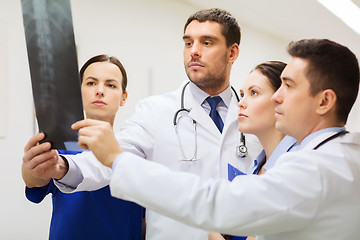 Image showing group of medics with spine x-ray scan at hospital