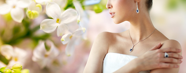 Image showing beautiful woman with earring, ring and pendant