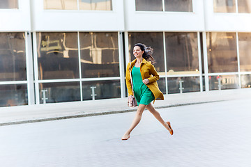 Image showing happy young woman or teenage girl on city street