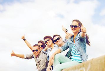 Image showing teenagers showing thumbs up