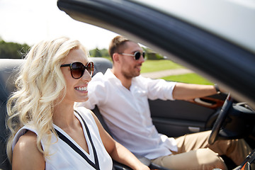 Image showing happy man and woman driving in cabriolet car