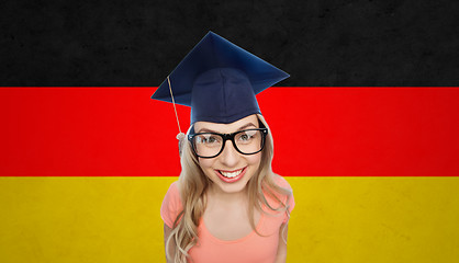 Image showing smiling young student woman in mortarboard