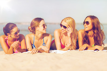 Image showing group of smiling women in sunglasses on beach