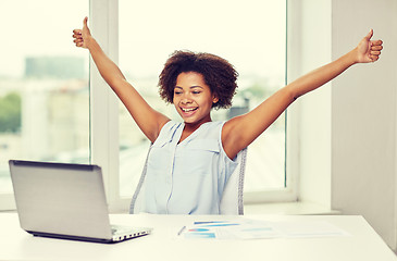 Image showing happy african woman with laptop at office