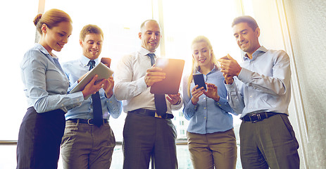 Image showing business people with tablet pc and smartphones