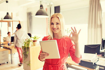 Image showing woman with tablet pc showing ok sign at office