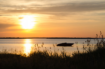 Image showing Boat silhouette by sunset