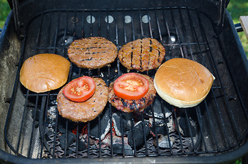 Image showing Hamburgers on the grill