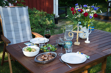 Image showing Dinner table in the garden