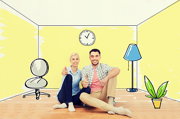 Image showing happy couple showing thumbs up at new home